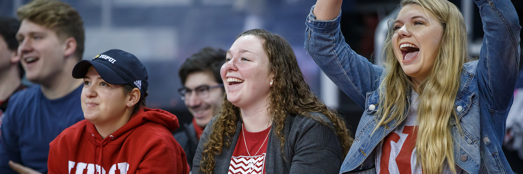 Students cheering at an IUPUI sporting event.